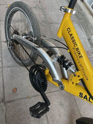 горный велосипед: Sarı rəngli qatlanan şəhər velosipedi Xüsusiyyətlər: - Qatlanma — 5