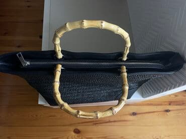 qaşlı çanta: Stradivarius böyük həsir çanta.Kənarları kojadır,qulpu bambukdur.1 — 4