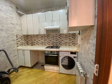 lokbatanda yeni tikilen binalar: Həzi Aslanov metrosuna yaxin Gəncə prospektində 16 mertebeli binanın — 4