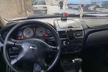 guzgu manitor: Nissan Sunny (N16) sedan – ağ rəng Xüsusiyyətlər: - Kuzov: 4 qapılı — 7