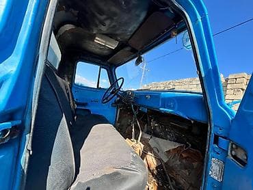 vaz oka satilir: Məhsul: Yük maşını – mavi rəngli, yanları taxta uzadılmış üçtərəfli — 6