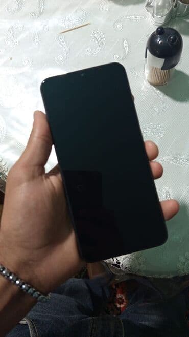 redmi 9 t ekran: Xiaomi Redmi smartfon - Model: Redmi (arka qapaqda “Redmi” loqosu) - — 2