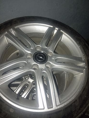 r16 disk teker: Opel üçün yüngül lehimli disk və şin dəsti - Marka/loqo: Opel mərkəz — 1