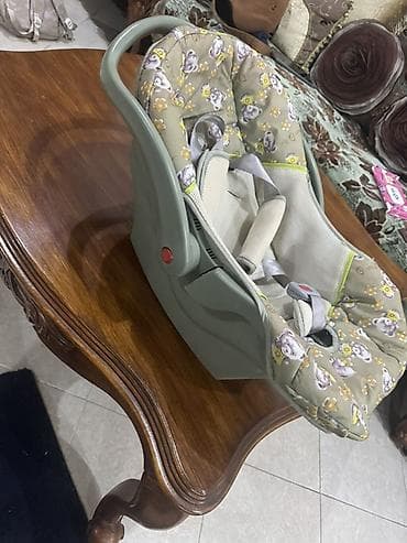 Ushaq ucun avtokreslo satilir korpe vaxti sebet kimide istifade etmek