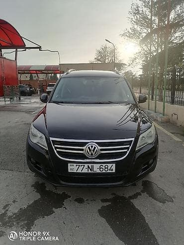 mercedes e 2: Volkswagen Tiguan: 2 l | 2009 il Ofrouder/SUV — 1