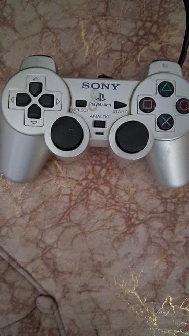 2 ci el 14 pro max: Sony PlayStation 2 Slim (gümüş rəng) Komplekt: - PS2 Slim konsolu — 2