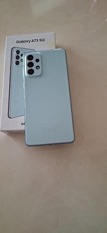 Мобильные телефоны и аксессуары: Samsung Galaxy A73 5G, 128 ГБ, цвет - Зеленый, Сенсорный, Отпечаток пальца, Две SIM карты — 2