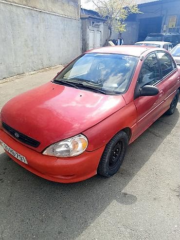 Kia Rio sedan – qırmızı rəngli maşın sürülən maşındı zapcast kimi