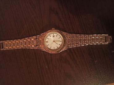 saat apple: Metallik qızılı rəngdə, relyef naxışlı korpus və breloku olan klassik — 1