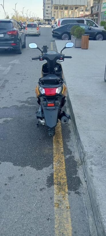 купить мопед в кредит: === PART 1: TEXTUAL DESCRIPTION === Sarı rəngli, müasir dizaynlı — 3