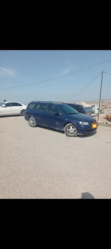 Opel Astra Caravan (universal kuzov), tünd mavi rəng. Xüsusiyyətlər