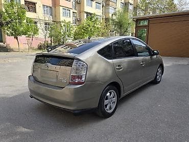 hyundai satilir: Toyota Prius (2-ci nəsil) hibrid hetçbek - Qizili rəng, 5 qapı - — 5