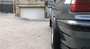 r18 bmw: BMW 3 Series E36 sedan – tünd boz rəngdə, klassik kuzov xəttləri ilə — 4