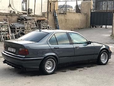 r18 bmw: BMW 3 Series E36 sedan – tünd boz rəngdə, klassik kuzov xəttləri ilə — 2