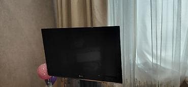 LG televizor - Ekran: təxminən 24–27 düym, düz LED panel - Rəng: qara