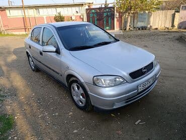Avtomobil alışı: Opel Astra sedan — gümüşü rəng Əsas xüsusiyyətlər: - Kuzov: 4 qapılı — 1