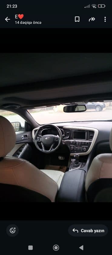 maşın ucun: Kia Optima sedan – ağ rəng, qara damla ikiqat tonlu eksteryer. Nömrə — 4