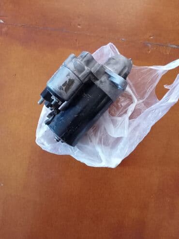 vurulmuş maşınlar: Avtomobil starter motoru, model 18949N. 12 volt gərginliklə işləyir və — 2