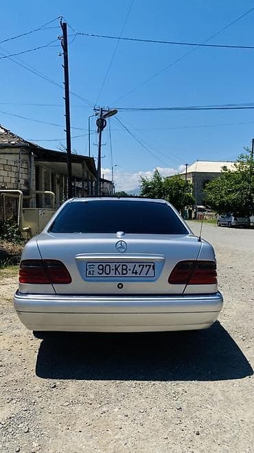 kia rio qapi: Mercedes-Benz E-Class: 2.8 l | 1997 il Sedan — 6
