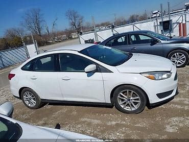 şevralit avtomobil: Ford Focus sedan, ağ rəng. - Kuzov: 4 qapılı sedan, aerodinamik qabaq — 3