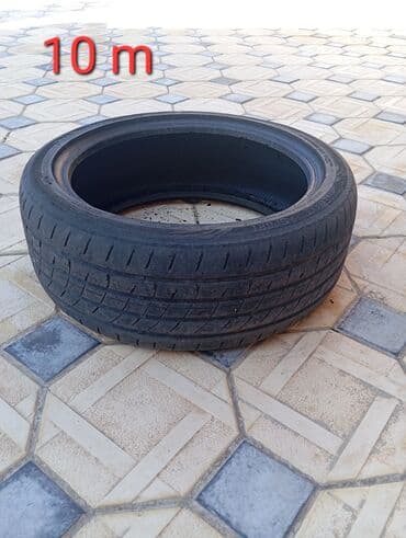 Disk təkərlər: Avtomobil şini - Ölçü üzərində “10 m” qeydini olan təkər - Yay tipli — 1