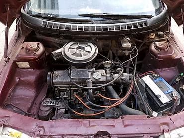 nissan sunny 2007: Tünd qırmızı rəngdə Lada 2110 sedan avtomobili. Bu model, dörd qapılı — 8