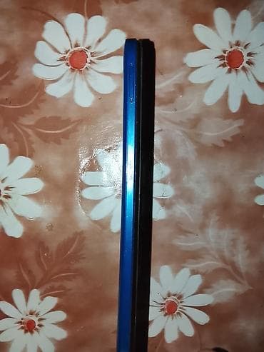 a 32 telefon: Mavi rəngli smartfon - Korpus: yan çərçivə parlaq mavi, sol tərəfdə — 1