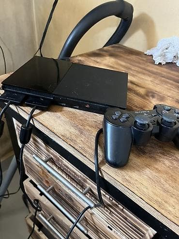 Sony PlayStation 2 Slim (SCPH seriyası) - Kompakt “Slim” korpus, qara