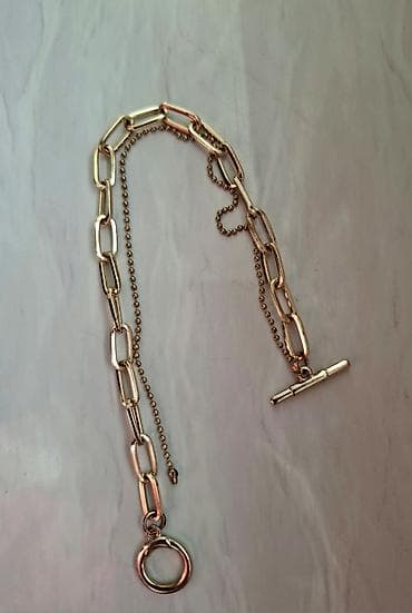 qol saati casio: Qızıl rəngdə bilərzik. Rəngi dəyişməyən. 
Uzunluq: 21 sm — 1