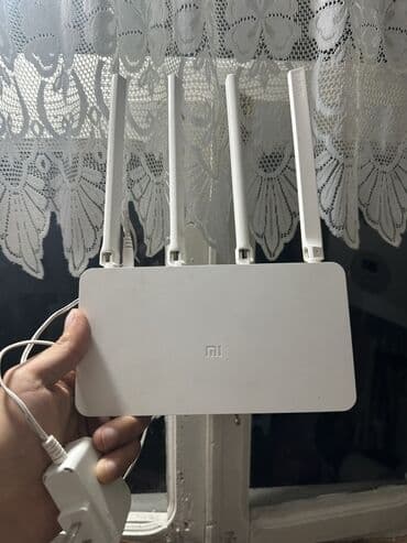 naxtel elaqe: Ağ rəngdə olan Xiaomi router, evdə və ya ofisdə internetə qoşulmaq — 5