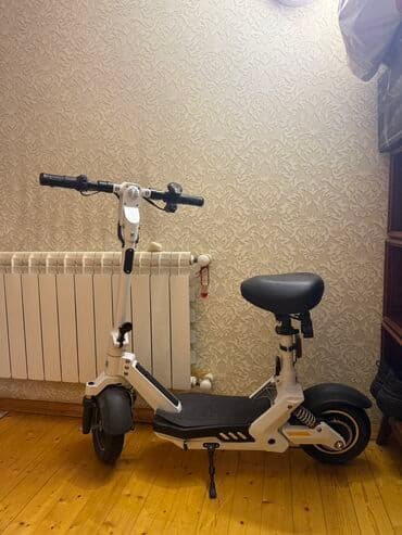 Elektrik skuter – oturacaqlı, kompakt və rahat - Rəng: ağ-qara - lalafo.az -da Elektrik skuter – oturacaqlı, kompakt və rahat - Rəng: ağ-qara -