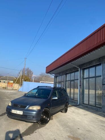oka satılır: Model: Opel Astra Caravan (universal kuzov) Rəng: tünd boz Yanacaq — 15