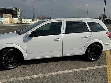 afdomobil: Opel Astra Caravan (Universal) - Kuzzov: universal (Caravan), ağ rəng — 4