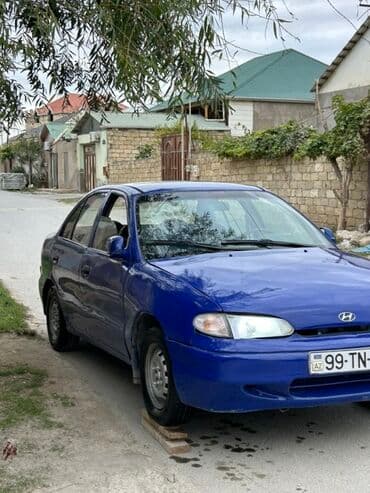 kia sou 2013: Hyundai Accent: 1.5 l | 1995 il Sedan — 2