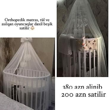 Ağ rəngli dairəvi uşaq beşiyi. Komplekt: - Ortopedik matras - Tül — 1
