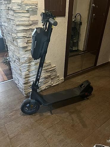 electro gitara: Xiaomi elektrik skuter. Şəkillərdə qara rəngli, minimalist dizayna — 1