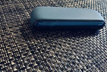 elektron qelyan gence: IQOS cihaz satılır, tünd göy rəngdədir. İkinci əldir, amma çox — 1