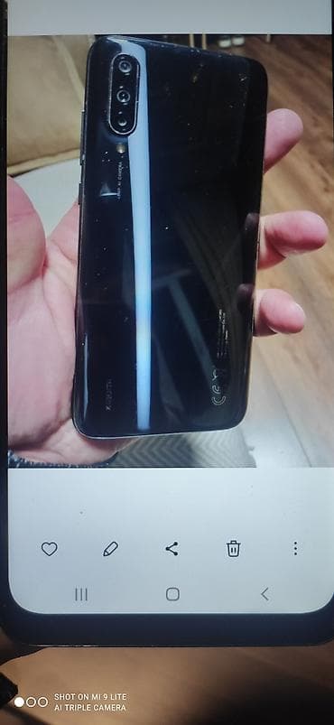 islemis telefonlarin satisi: Xiaomi Mi 9 Lite, rəng - Qara, 
 Barmaq izi — 4