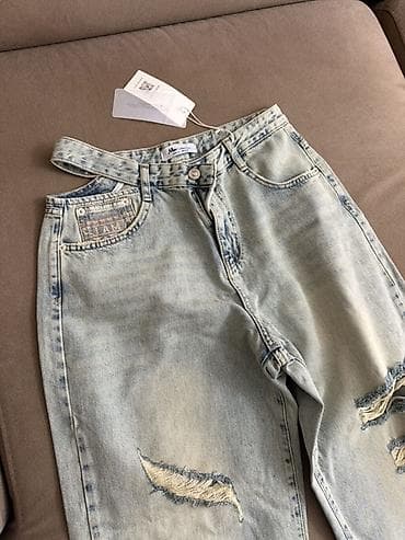 Açıq mavi yuyulmuş effektli, geniş kəsimli cins şalvar. - Model — 1