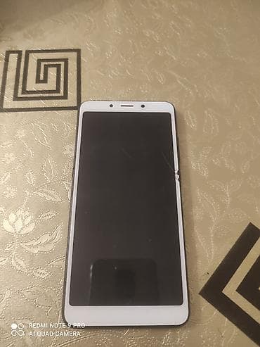 ən ucuz telfon: Smartfon – 5.5–6.0 düymlük tam ekranlı ön panel, ağ çərçivə - Ön — 1