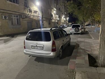 чемодан с инструментами для автомобиля: Opel Astra Caravan (universaI) – gümüşü rəngdə, 5 qapılı ailə və yük — 3