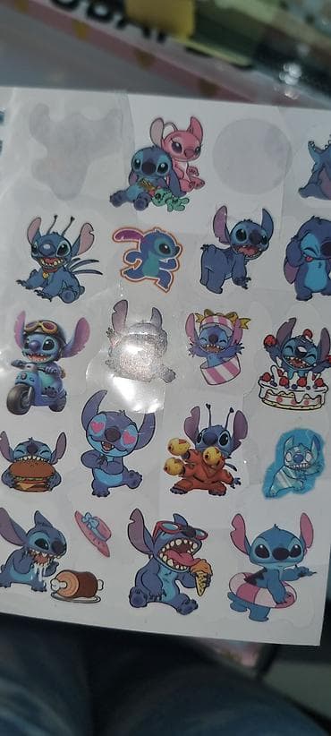 sevgililer ucun hediyyeler: Məhsul: Cizgi qəhrəmanlı yapışqanlı dəftər və stiker dəsti ikisi bir — 2