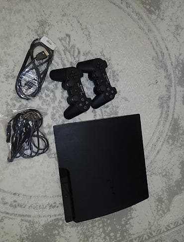Sony PlayStation 3 (PS3) Slim 512 yaddas icinde 60 oyun var 2 pult