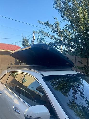 eşşək arabası: Avtomobil üçün dam üstü baqaj qutusu (roof box). Aerodinamik formalı — 5