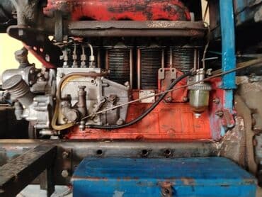 reduktor sürətlər qutusu: Mavi rəngli kabinalı təkərli traktor - Güclü dizel mühərrik (şəkildə — 4