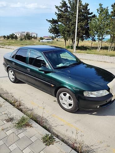lezva diskler: Opel Vectra B sedan – tünd yaşıl rəng, 4 qapı, 5 yerlik rahat salona — 3