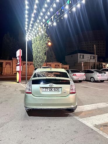 baqaj: Toyota Prius (2-ci nəsil) hibrid hetçbek - Gümüş-yaşıl rəngli kuzov — 2