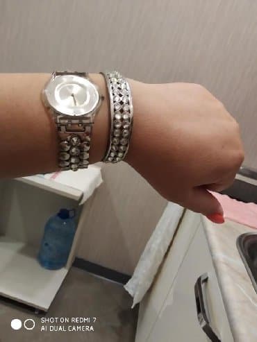 el fecr saat: İşlənmiş, Qol saatı, Swatch — 1