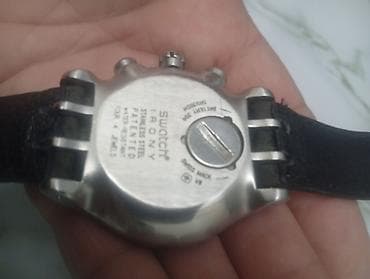 bakida saat: Qol saatı, Swatch, rəng - Gümüşü — 1