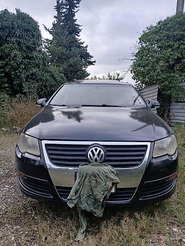 volqa ehtiyat hisseleri: Volkswagen Passat sedan. Avtomobilin salonu qara rəngdədir və ön — 3